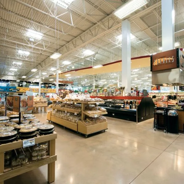 Premium linear high bay light featuring integrated motion and daylight sensors for smart, adaptive lighting control