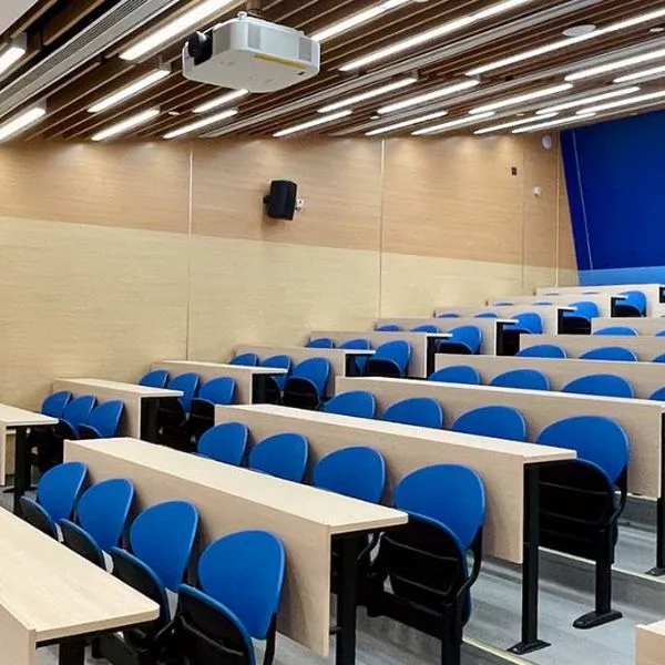 Library book stack lighting with asymmetric optics for optimized vertical illuminance.