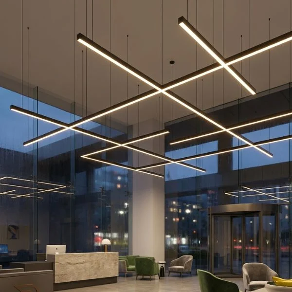 Large-scale continuous linear pendant grid lighting in a grand commercial entrance, featuring seamless joining kits and high-lumen output for expansive architectural spaces.