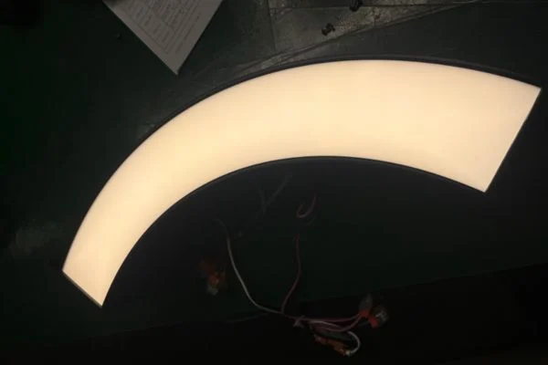 Curved linear lighting production photo showing pre-shipment inspection
