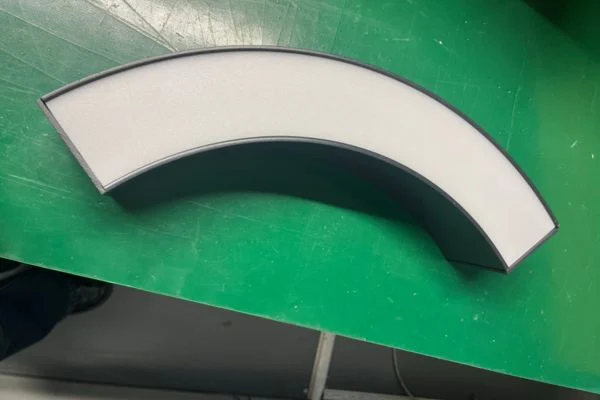 Curved linear lighting production photo showing module review